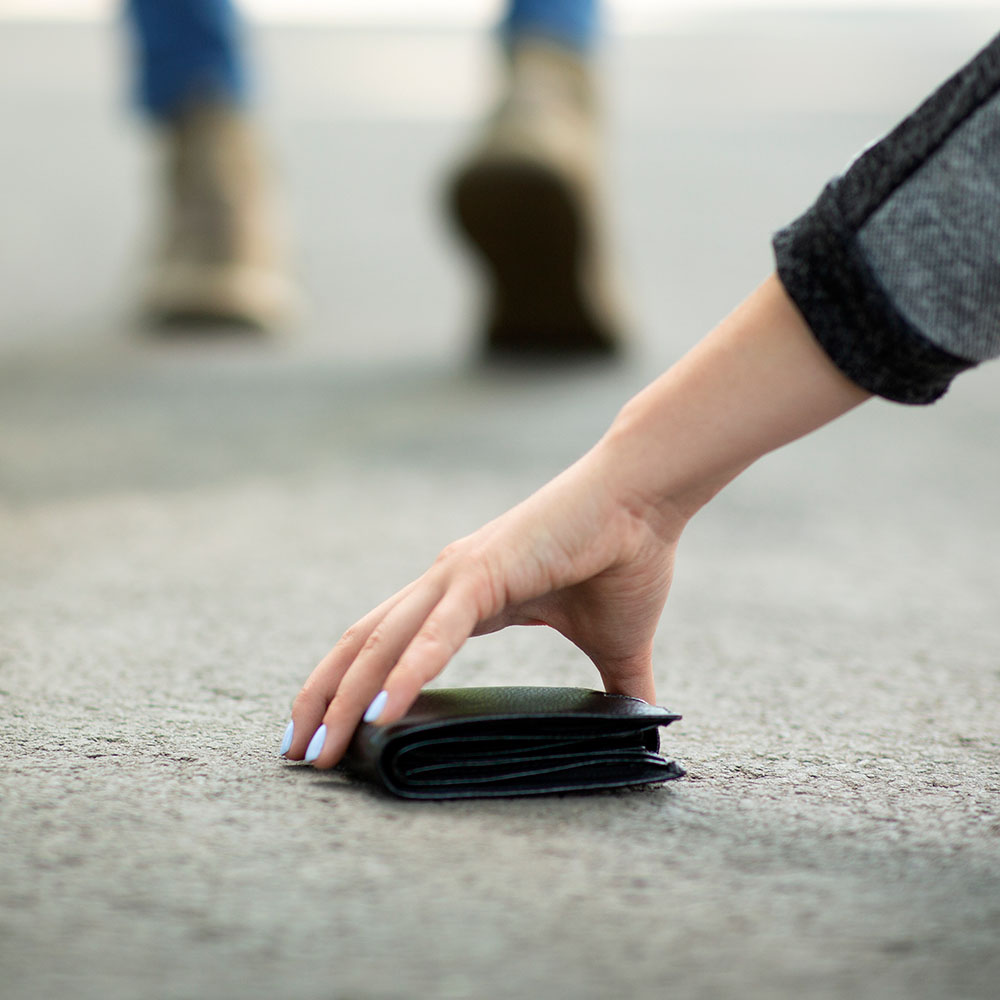 close-up-view-of-young-woman-picking-up-lost-walle-2021-09-02-05-02-11-utc